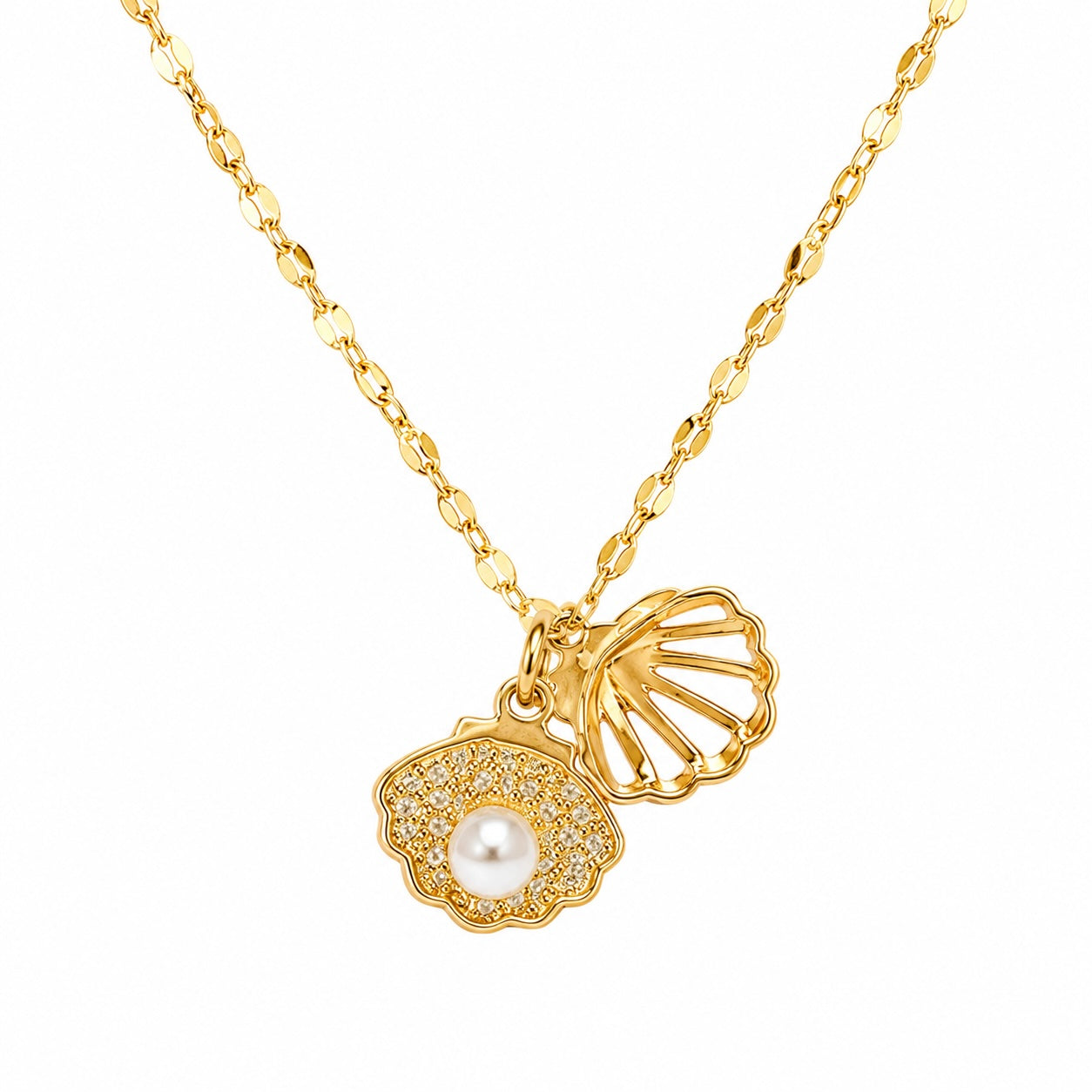 Gold necklace with shell and pearl pendant on a white background