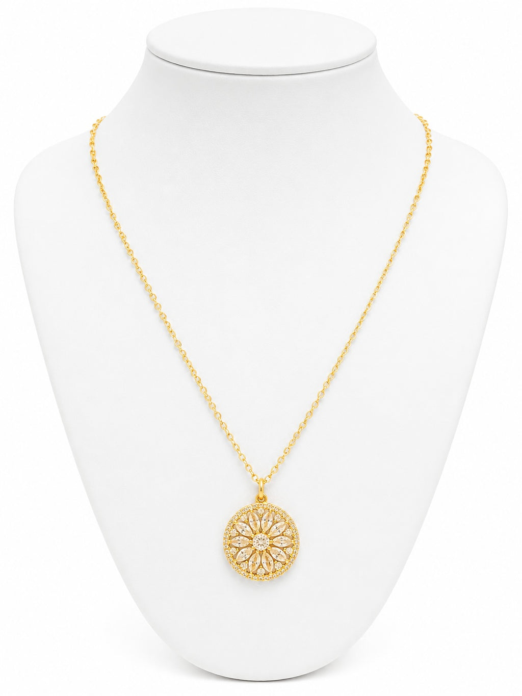 Gold necklace with a circular pendant on a white mannequin bust.