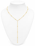 Gold necklace on a white mannequin bust
