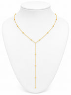 Gold necklace on a white mannequin bust
