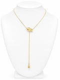 Gold necklace on a white mannequin 