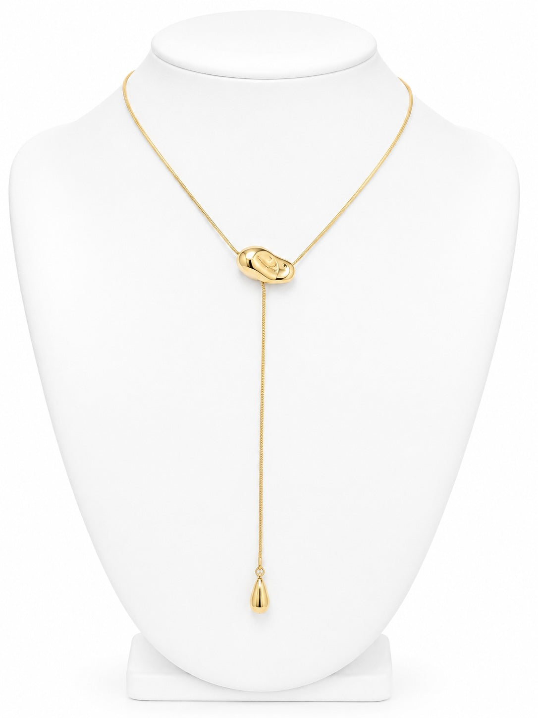 Gold necklace on a white mannequin 