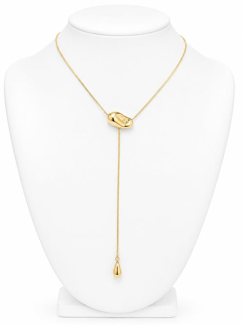 Gold necklace on a white mannequin 