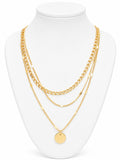 Gold chain necklace on a white mannequin bust