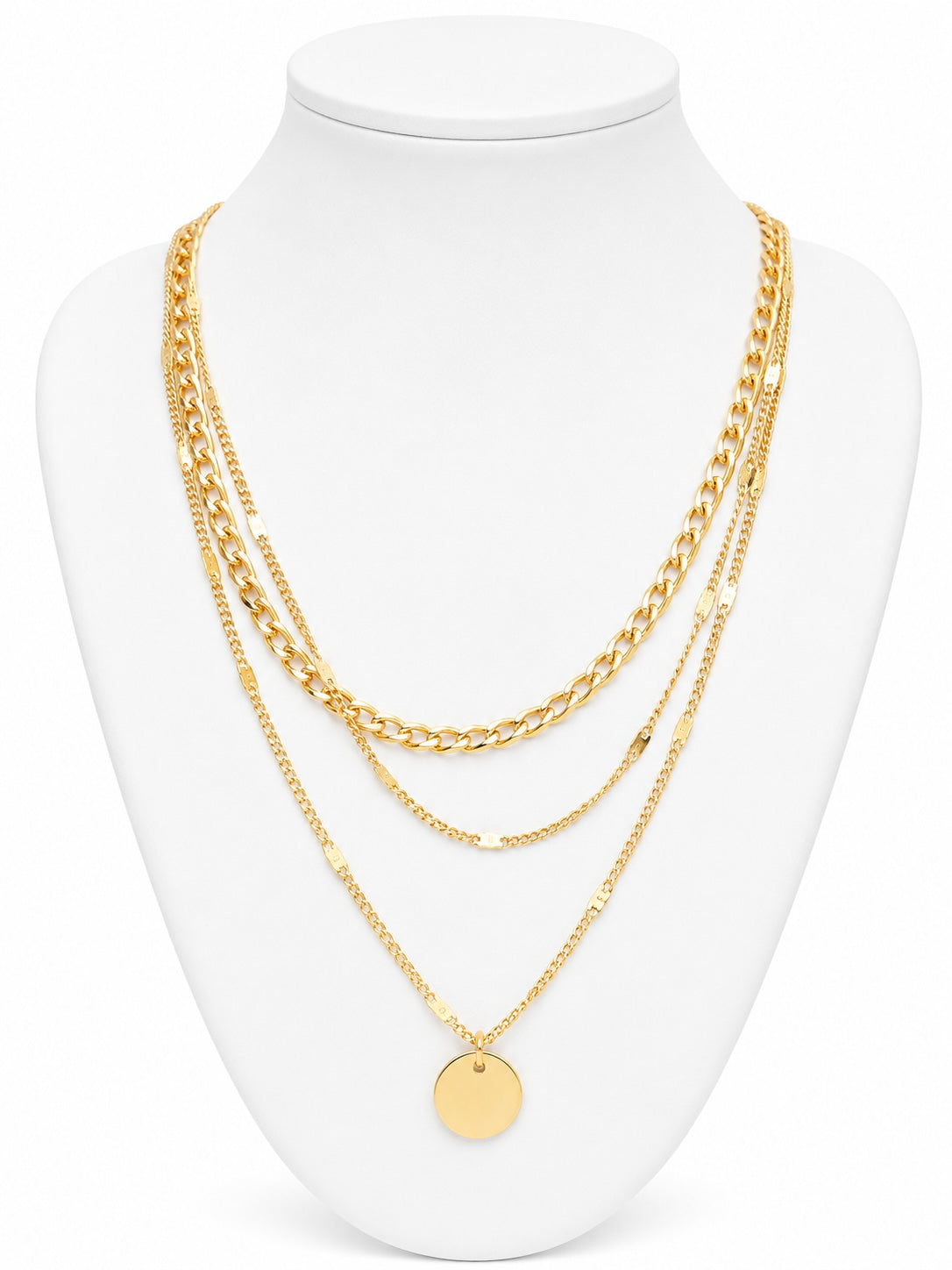 Gold chain necklace on a white mannequin bust