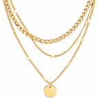 Three gold necklaces with different chain styles on a white background