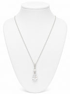 Necklace with a pendant on a white mannequin bust