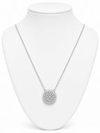 Silver necklace with a round pendant on a white mannequin bust.