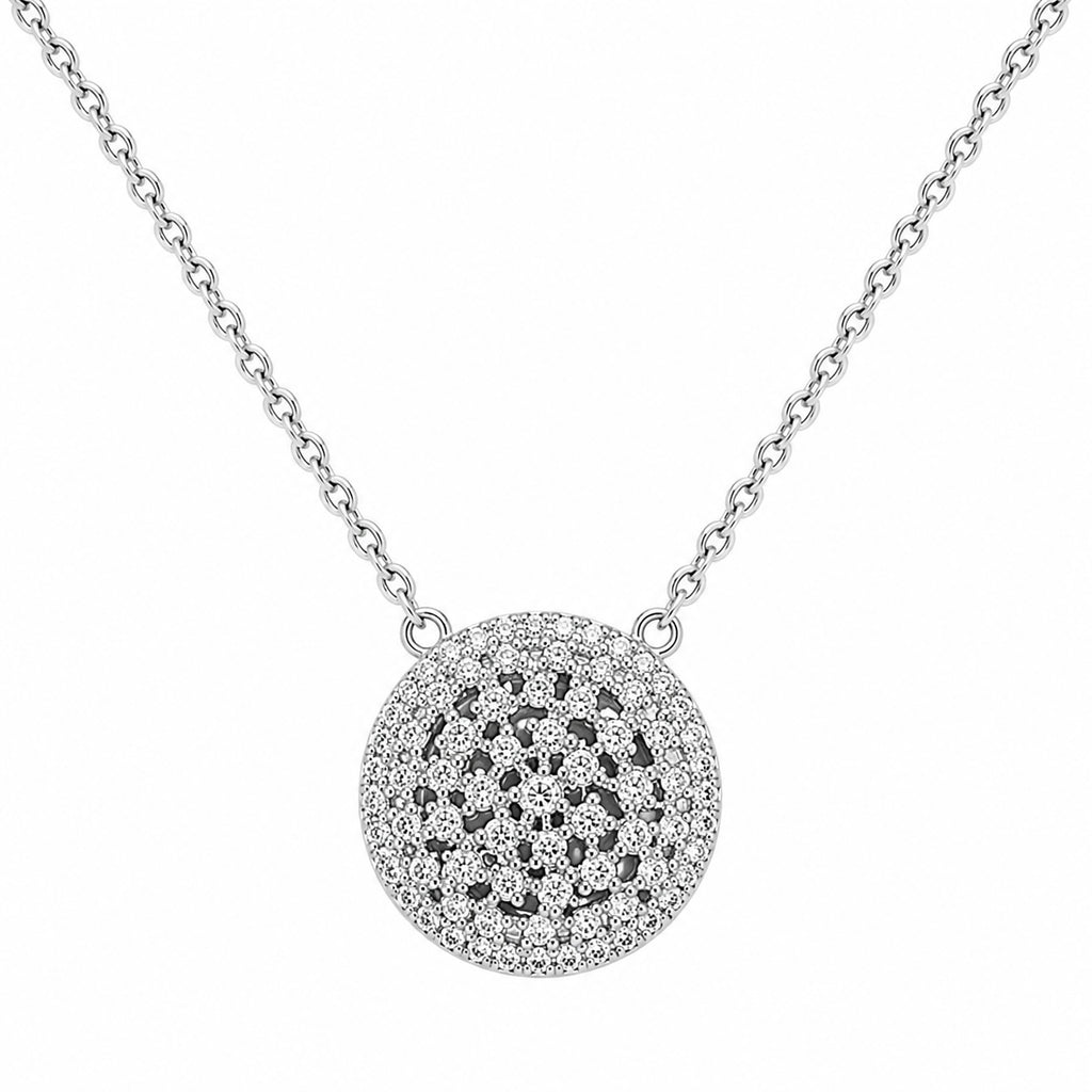 Silver necklace with a round, intricate pendant on a white background