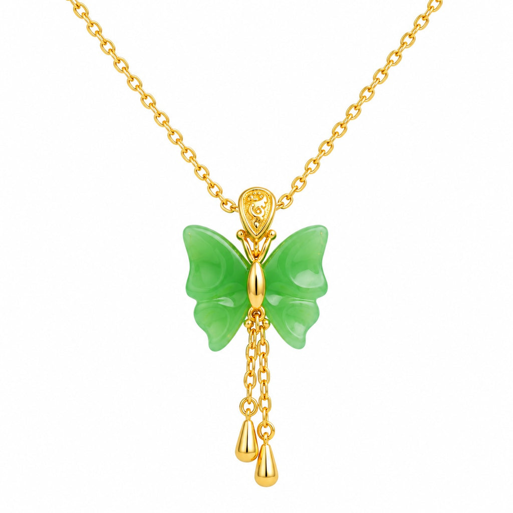 Butterfly-shaped green jade pendant with gold chain on a white background