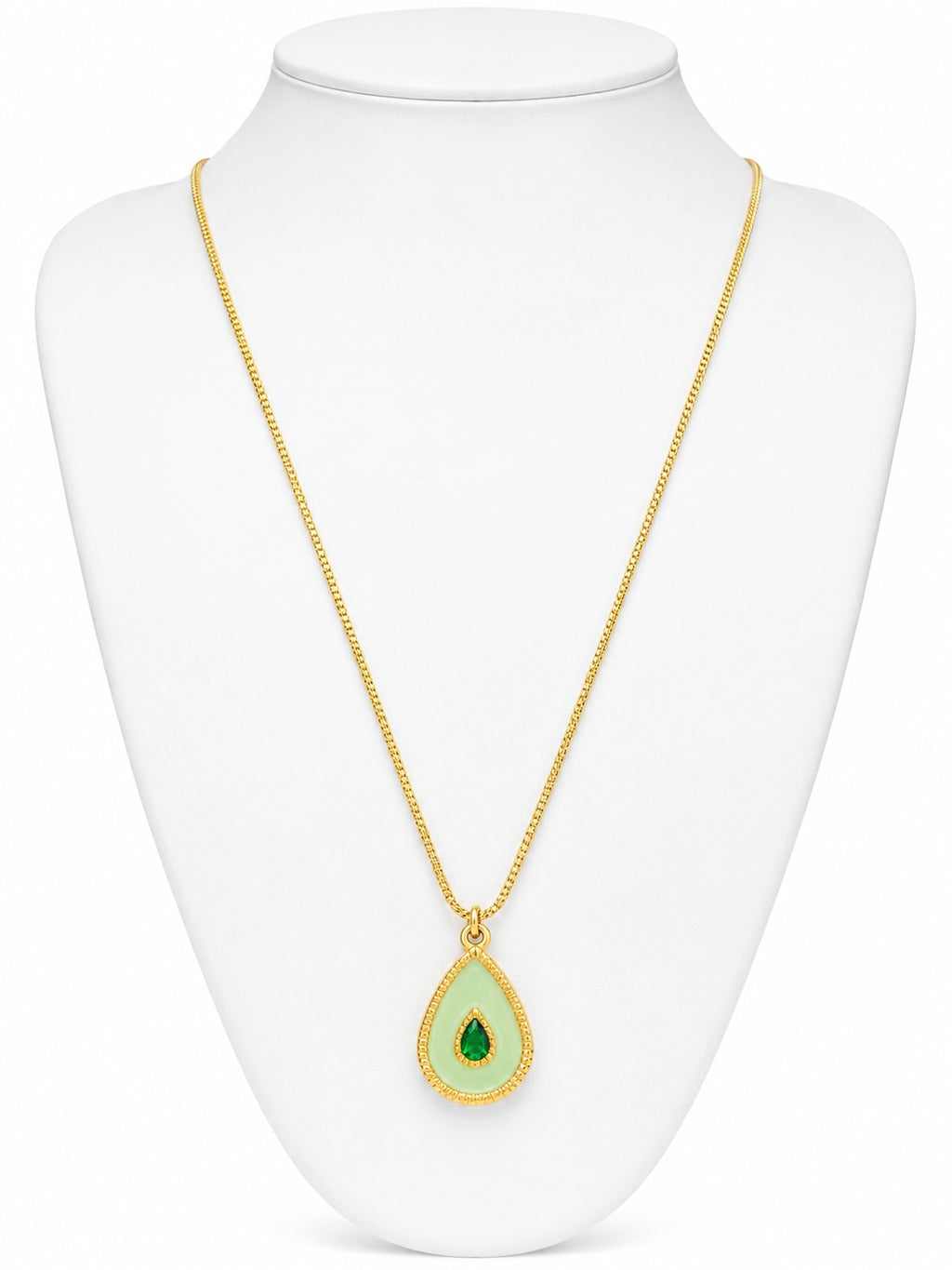 Gold necklace with a green teardrop pendant on a white mannequin bust.