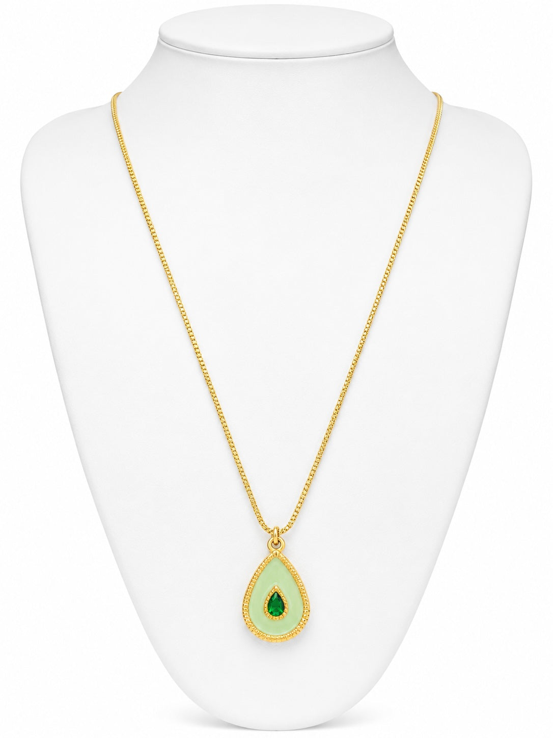 Gold necklace with a green teardrop pendant on a white mannequin bust.