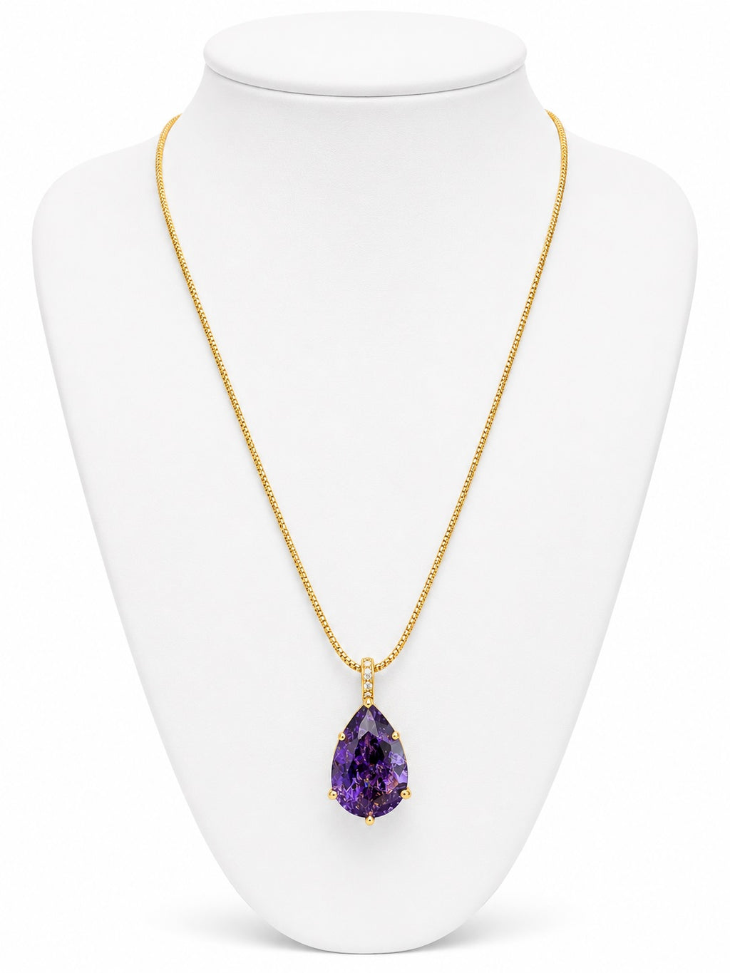 Gold necklace with a purple teardrop pendant on a white mannequin bust.