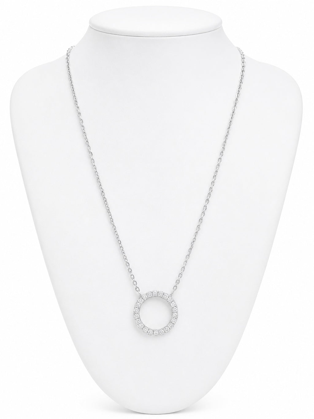 Silver necklace with a circular pendant on a white mannequin bust.