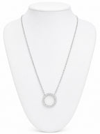 Silver necklace with a circular pendant on a white mannequin bust.