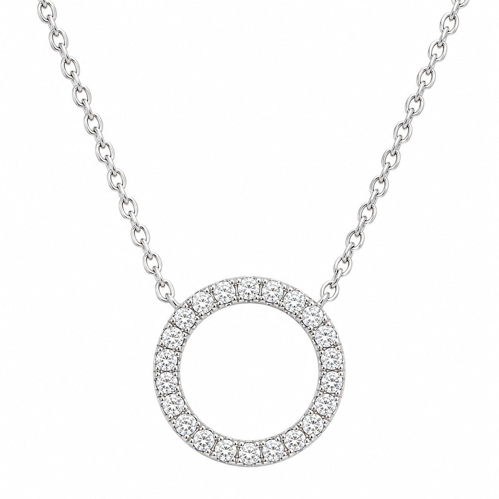 Silver necklace with a circular pendant on a white background