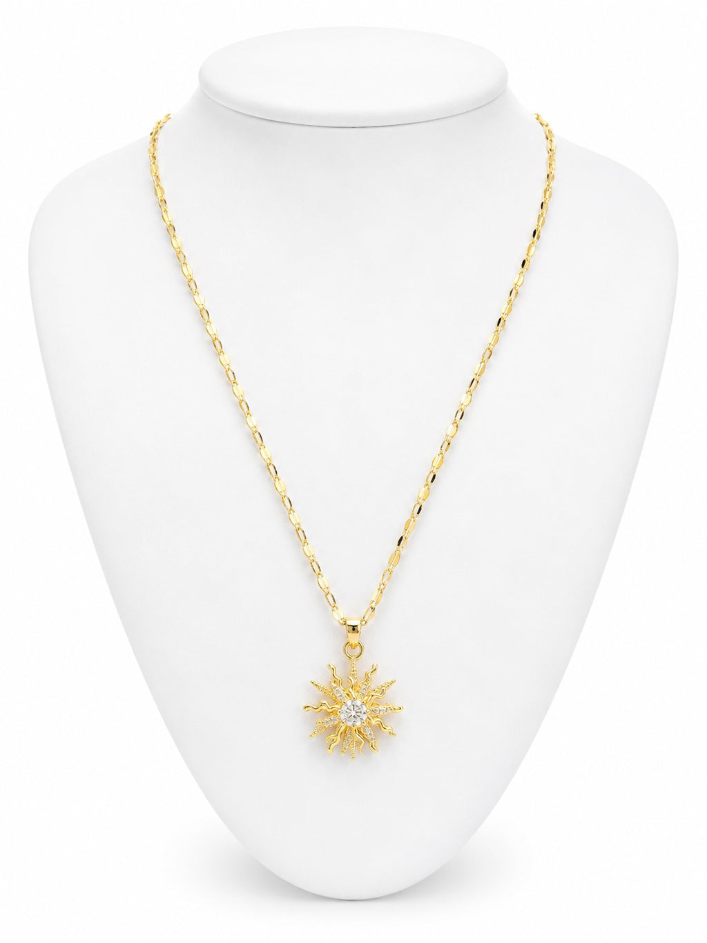 Gold necklace with a star pendant on a white mannequin bust
