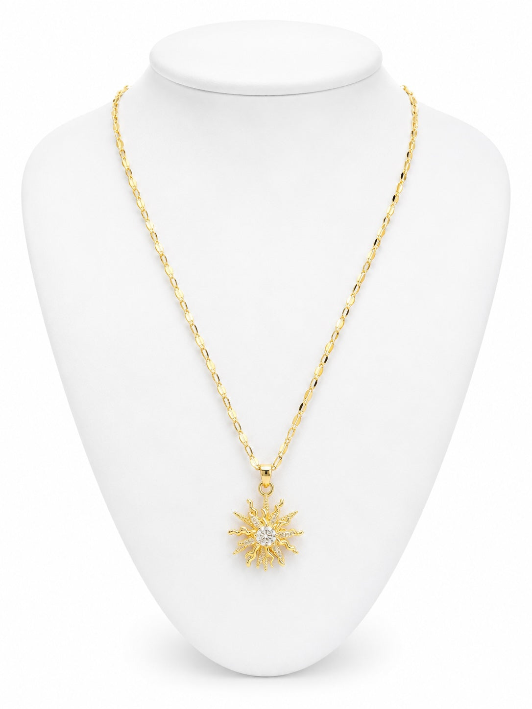 Gold necklace with a star pendant on a white mannequin bust