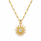 Gold sun-shaped pendant necklace on a white background