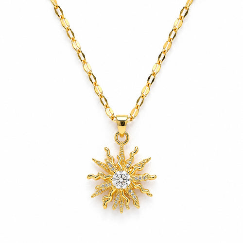 Gold sun-shaped pendant necklace on a white background