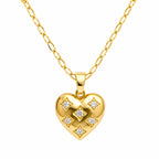 Gold heart-shaped pendant with diamond accents on a gold chain against a white background