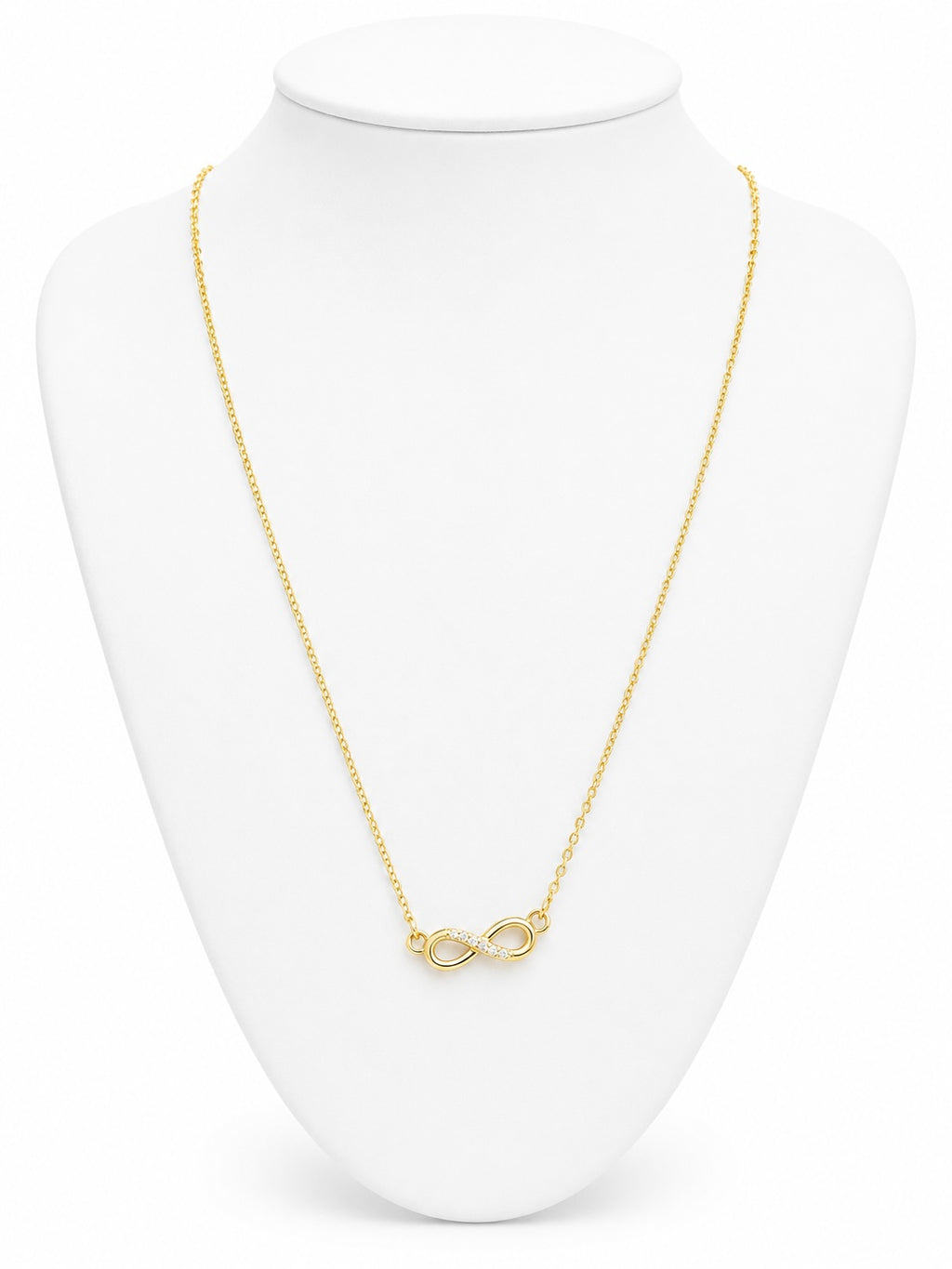 Gold infinity necklace on a white bust