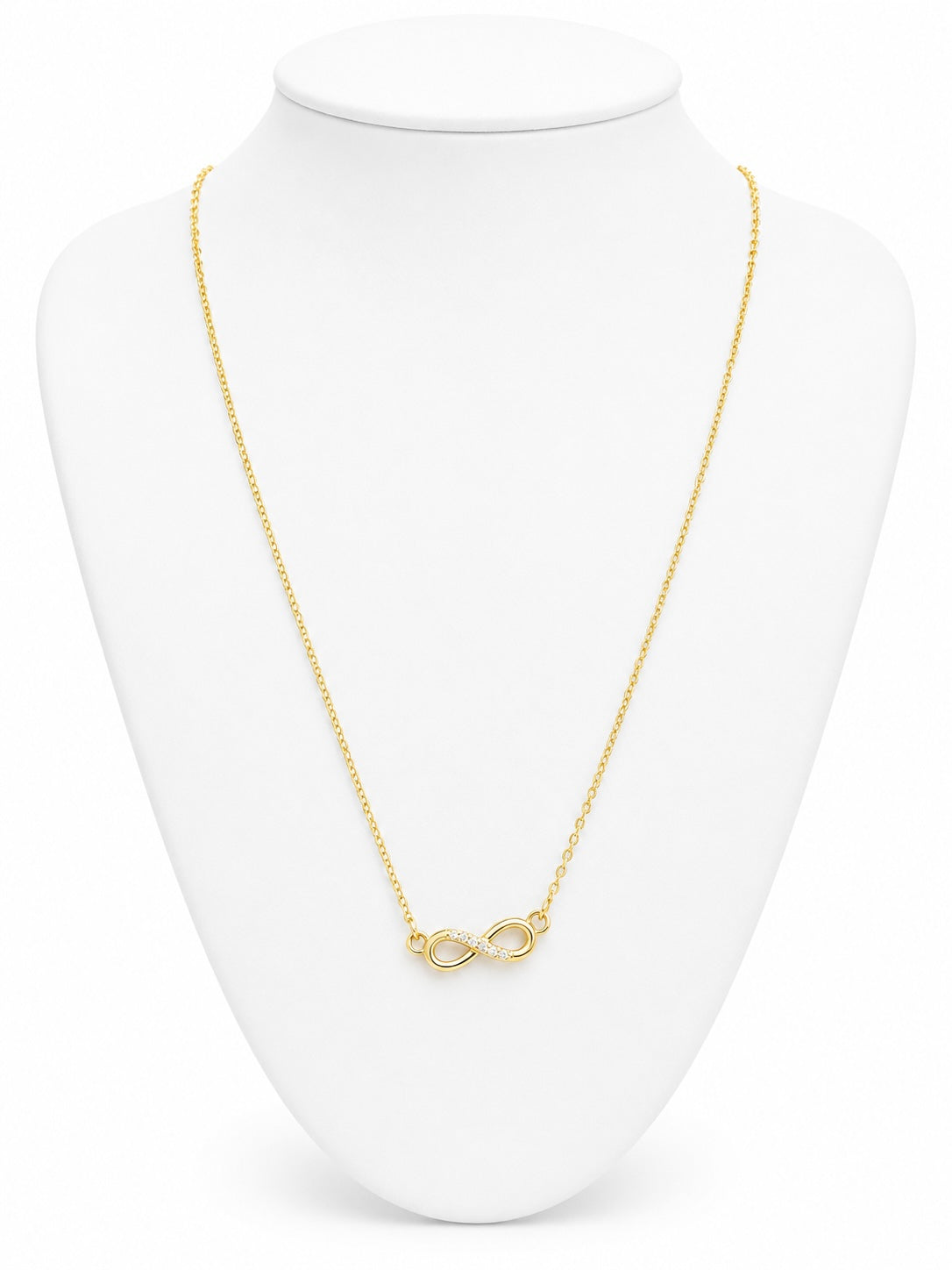 Gold infinity necklace on a white bust