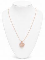Rose gold heart-shaped necklace on a white mannequin bust
