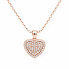 Rose gold heart-shaped necklace with diamonds on a white background