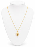Gold necklace with a star pendant on a white mannequin bust