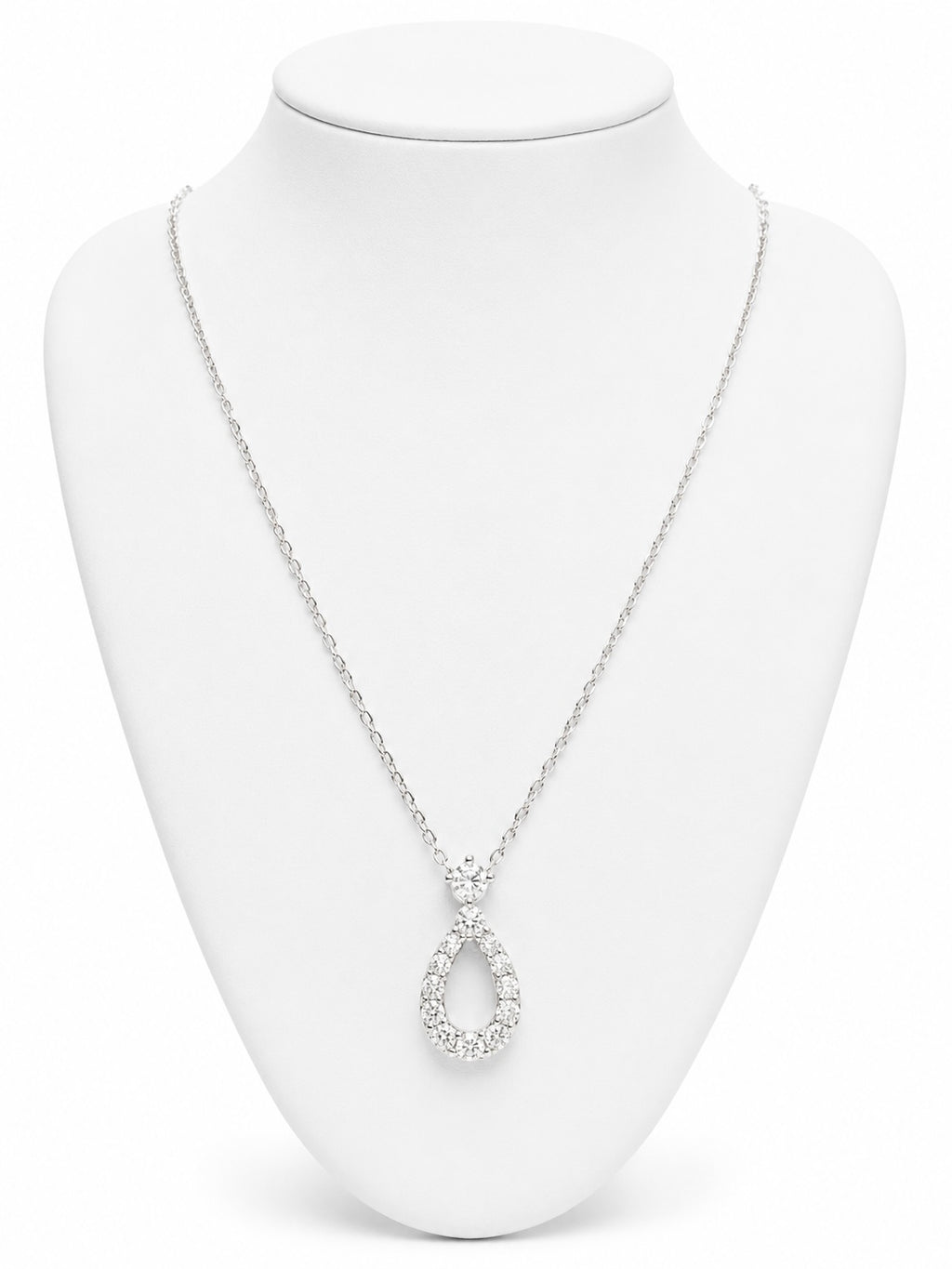 Silver necklace with a teardrop pendant on a white mannequin bust.