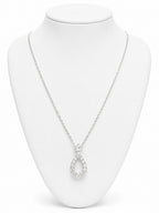 Silver necklace with a teardrop pendant on a white mannequin bust.