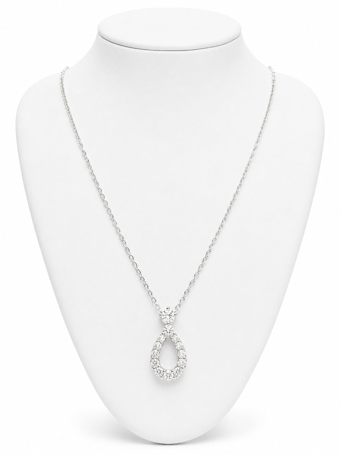 Silver necklace with a teardrop pendant on a white mannequin bust.