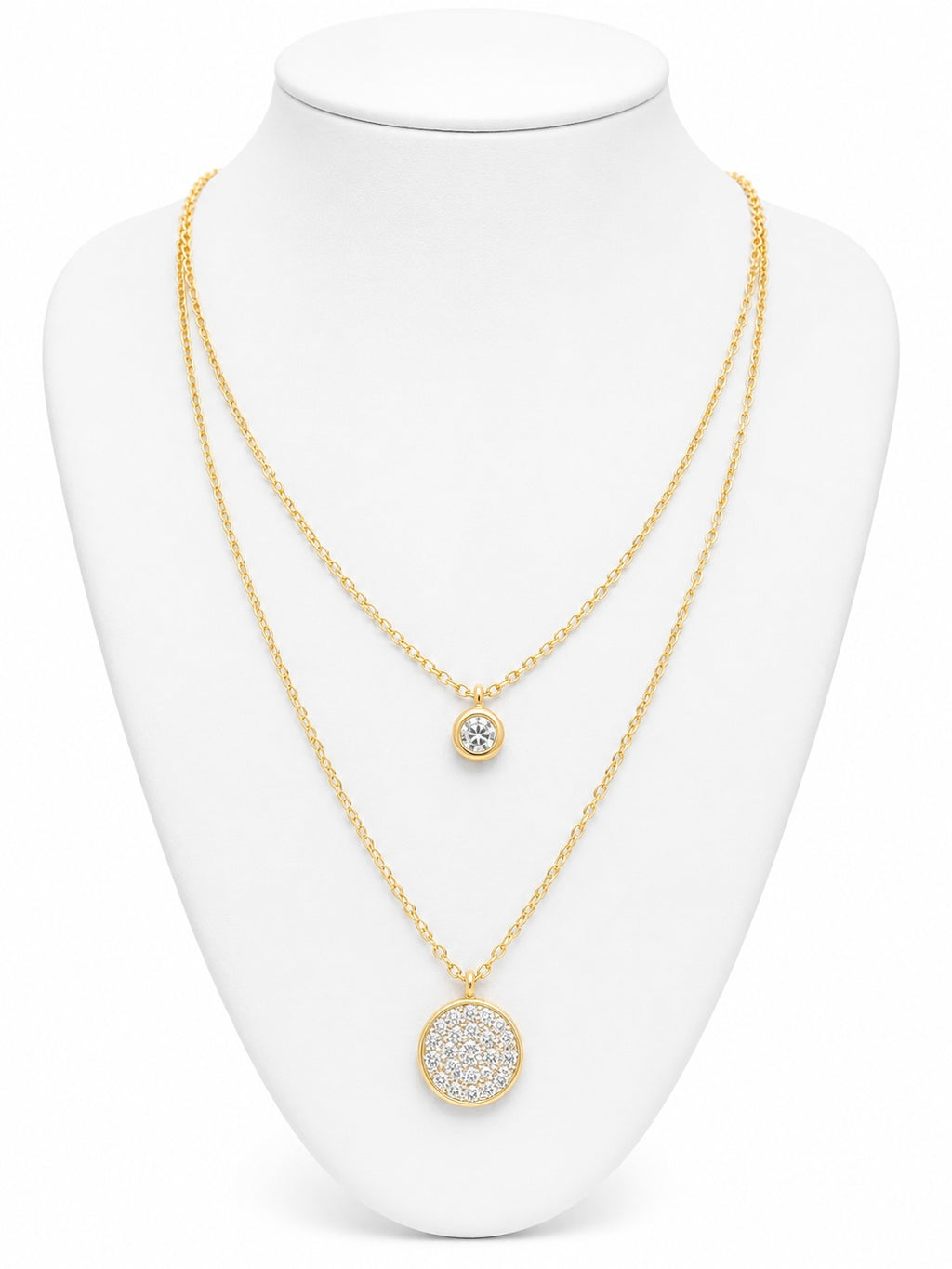 Gold necklace with circular pendants on a white mannequin bust