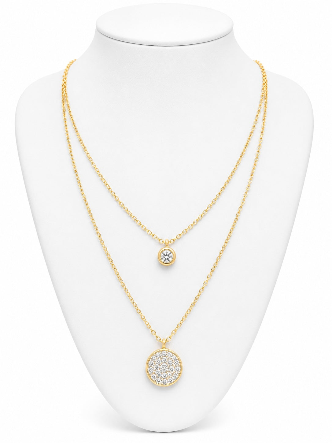 Gold necklace with circular pendants on a white mannequin bust
