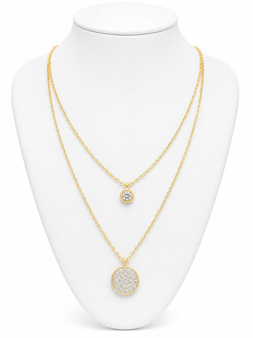 Gold necklace with circular pendants on a white mannequin bust