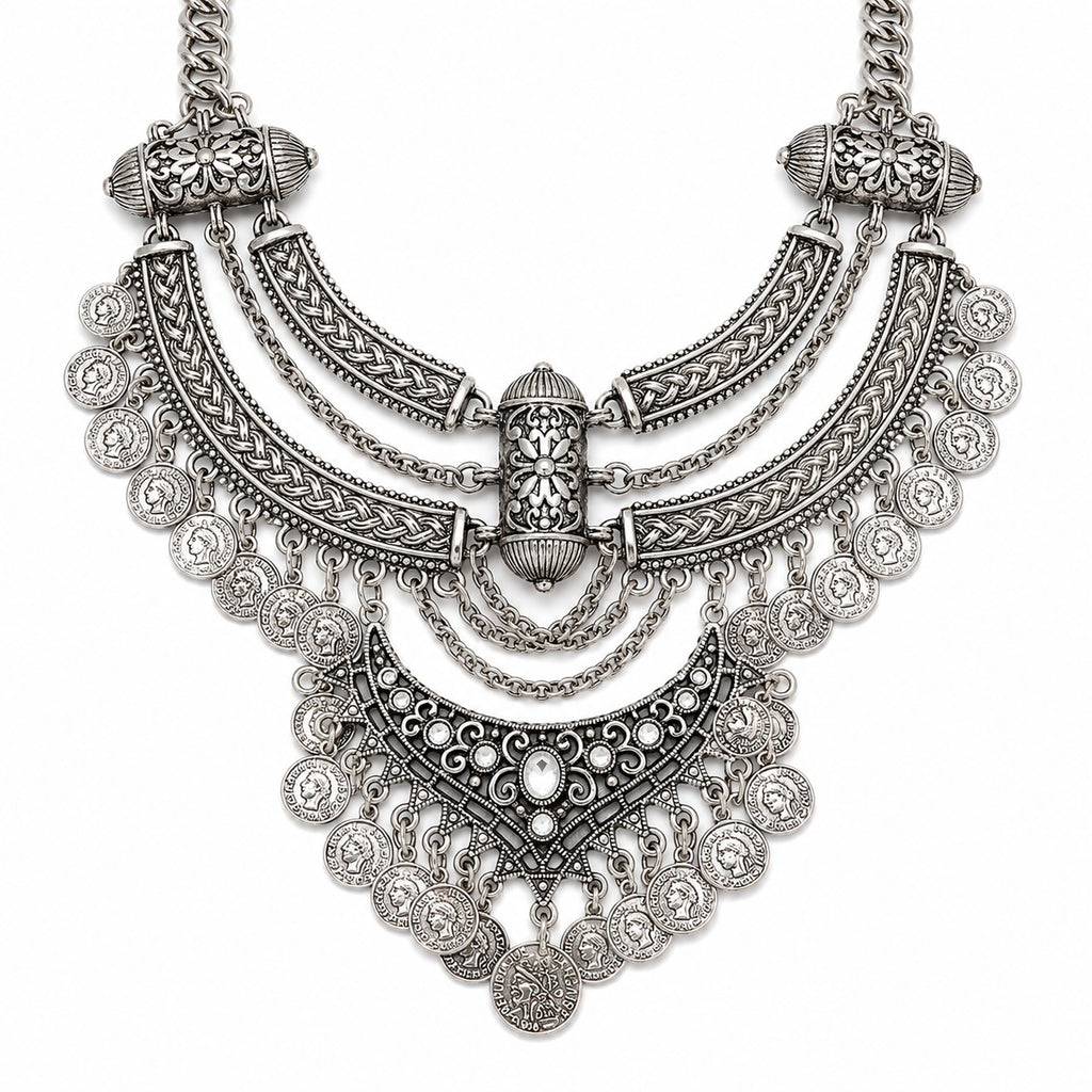 Ornate silver necklace on a white background