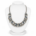 Necklace with pearls and blue stones on a white mannequin bust