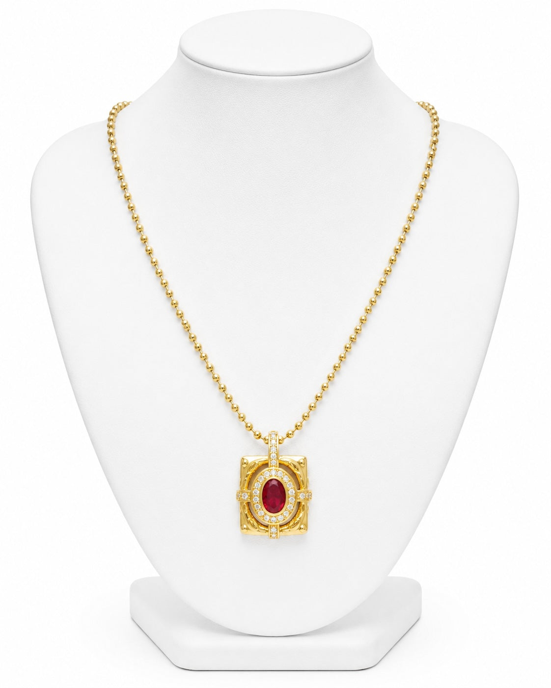 Gold necklace with a red gemstone pendant on a white mannequin bust.