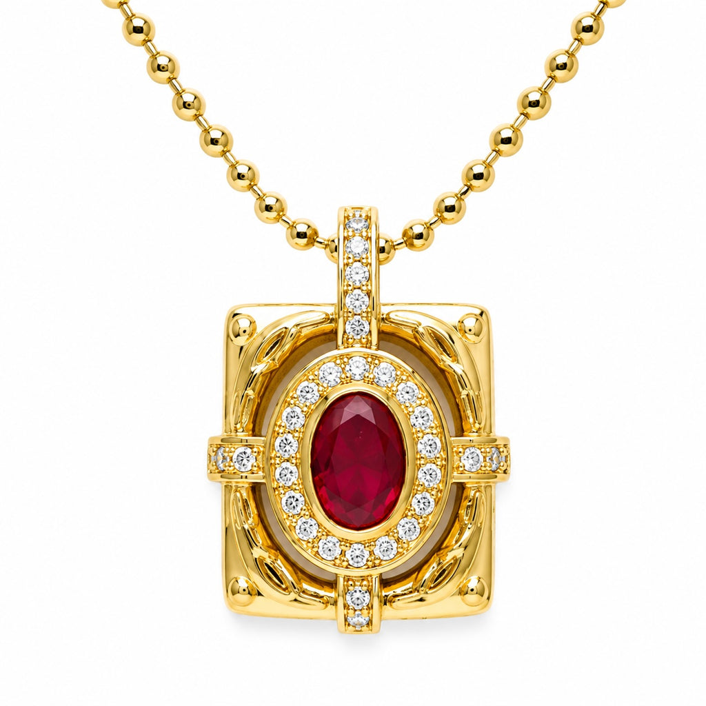 Gold pendant with a red gemstone and diamonds on a white background