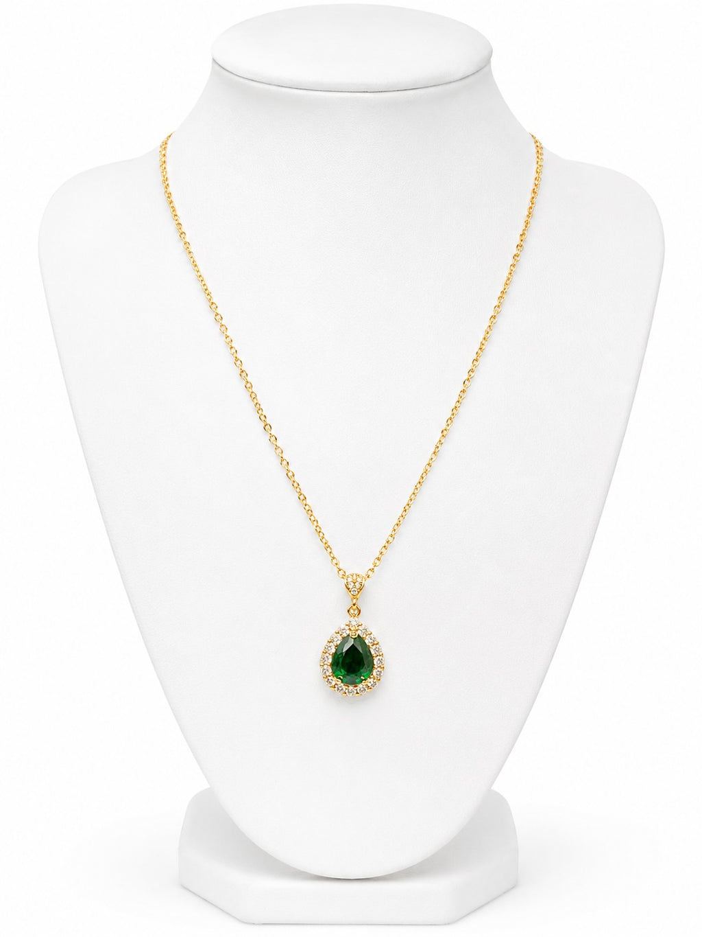 Gold necklace with a green teardrop pendant and diamond accents on a white background