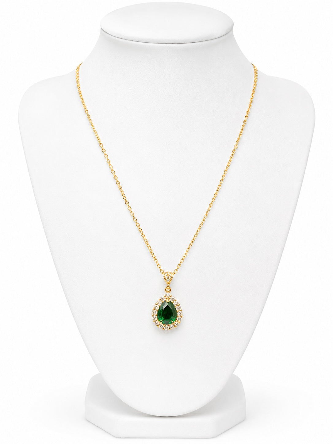 Gold necklace with a green teardrop pendant and diamond accents on a white background