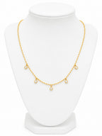 Gold necklace on a white mannequin bust