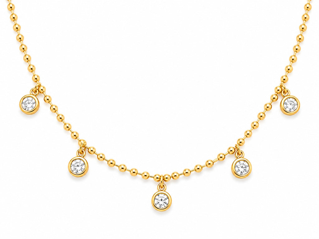 Gold necklace with diamond pendants on a white background