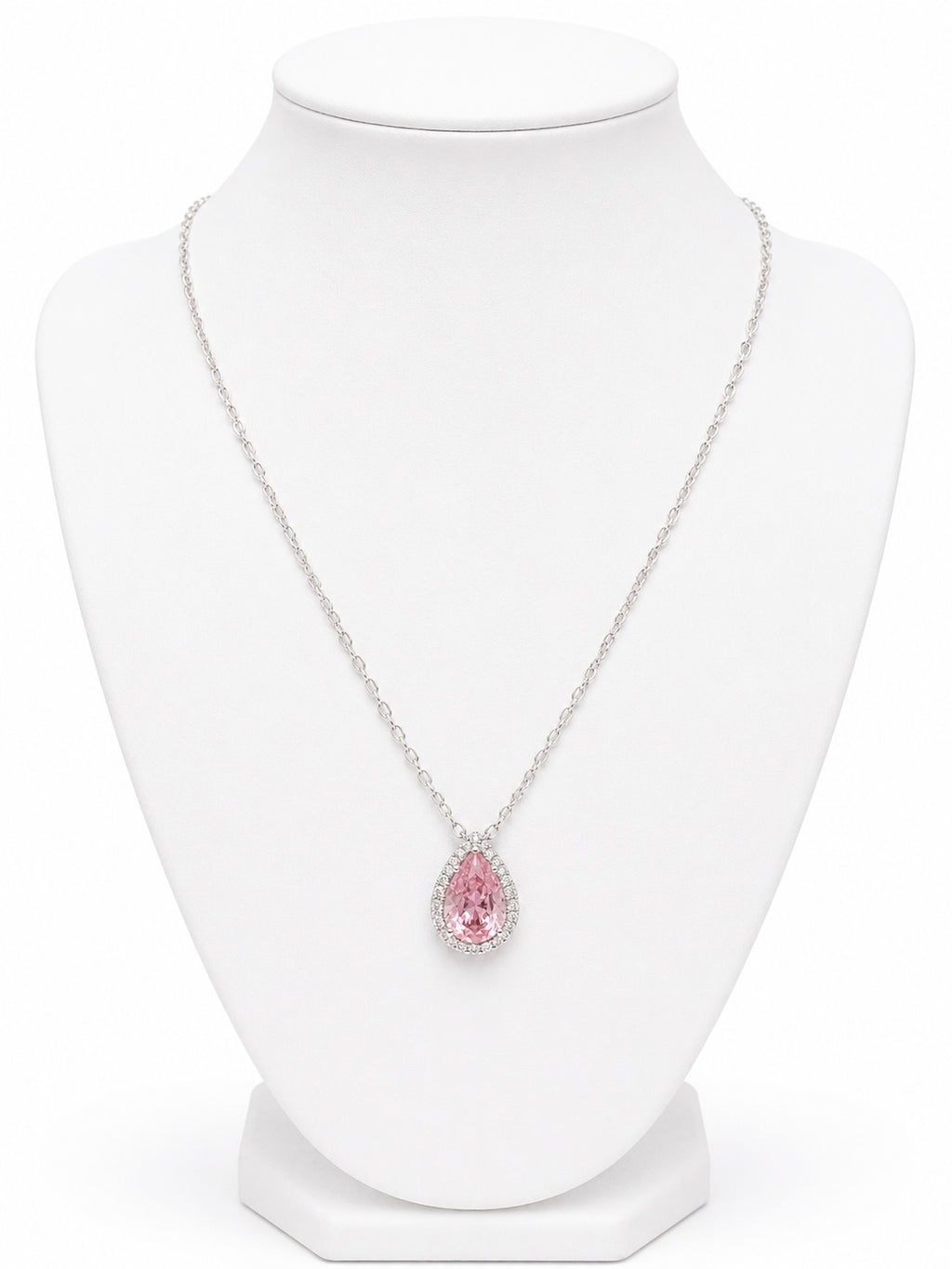 Necklace with a pink teardrop-shaped pendant on a white mannequin bust.