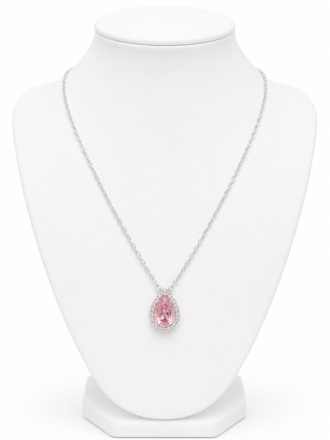 Necklace with a pink teardrop-shaped pendant on a white mannequin bust.