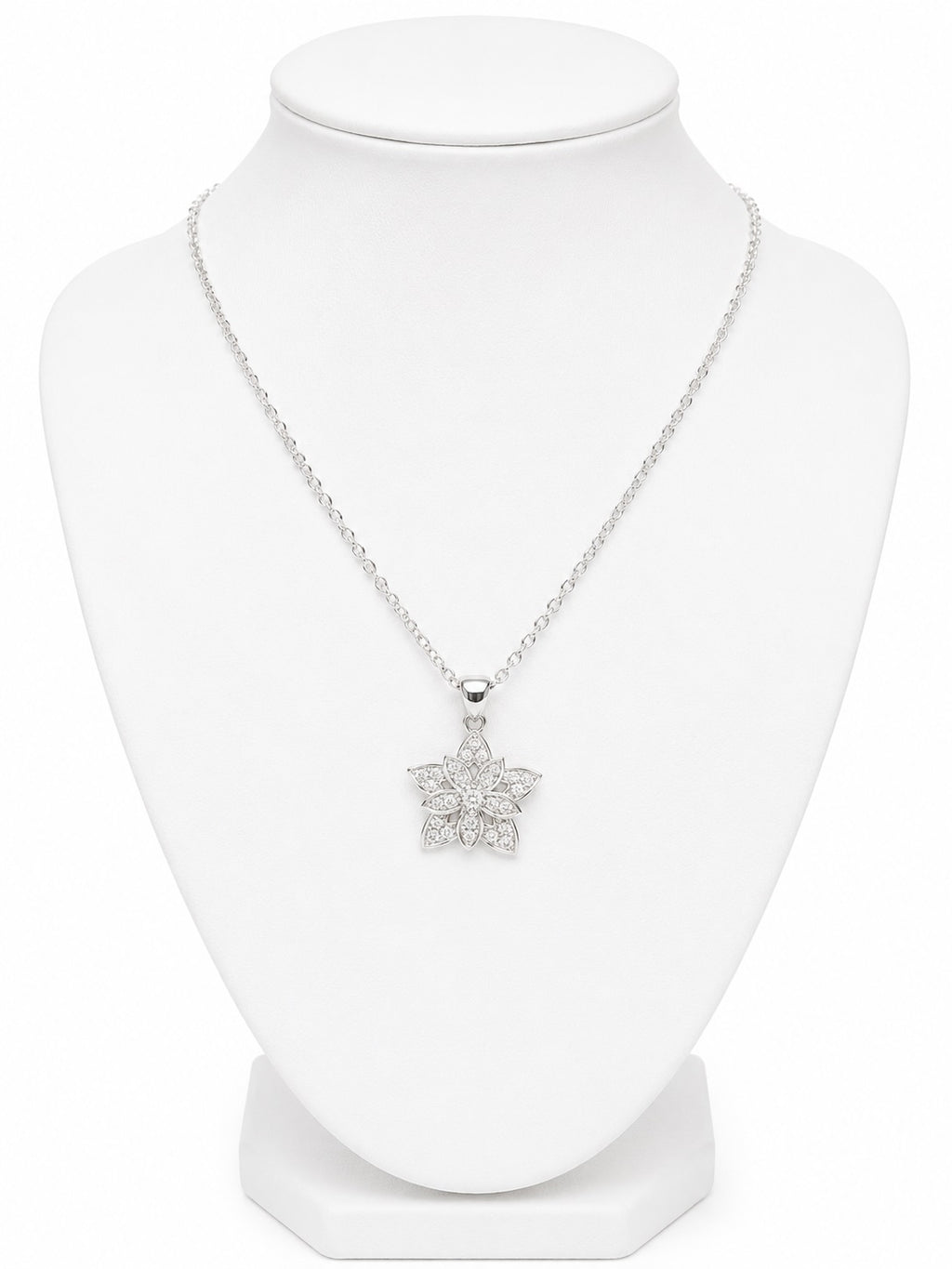 Silver necklace with a star-shaped pendant on a white mannequin bust.
