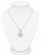 Silver necklace with a star-shaped pendant on a white mannequin bust.