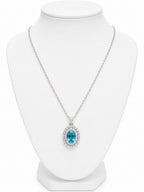 Necklace with a blue gemstone pendant on a white mannequin bust