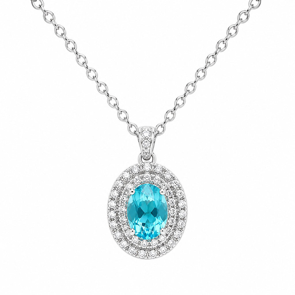 Diamond necklace with a blue gemstone on a white background